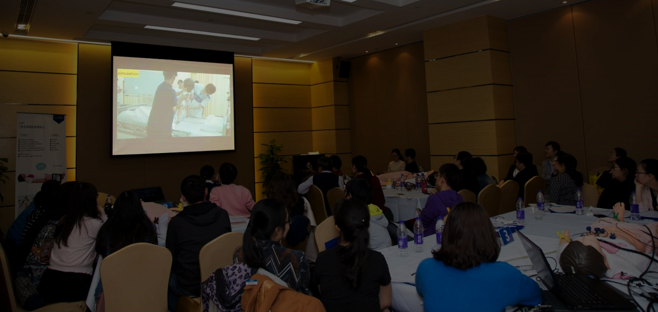attendees watching a video